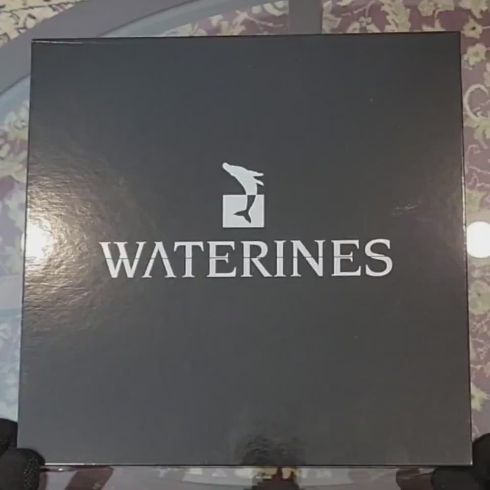 Euphoria Whale Set by Waterines — 3D sculpted magnetic resin whale sculptures breach through a glass coffee table.