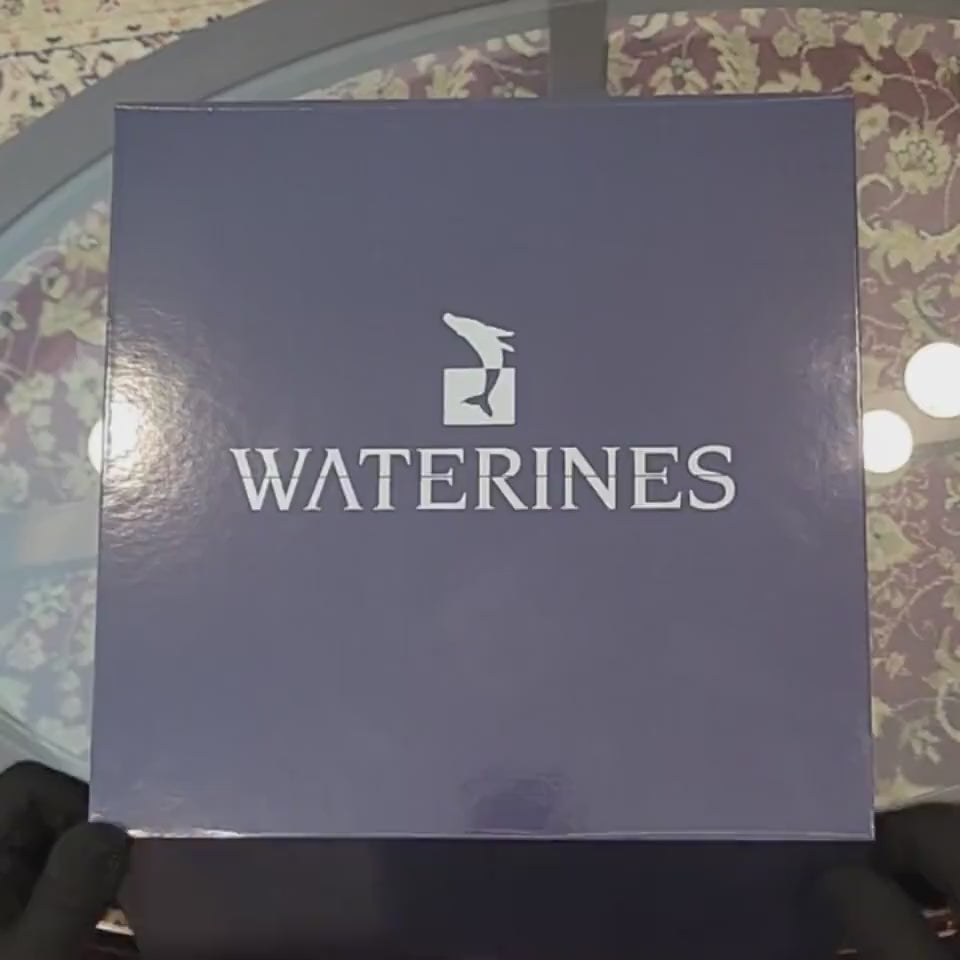 Harmony Dolphin Set by Waterines — 3D sculpted magnetic resin dolphin sculptures swim across a glass coffee table.