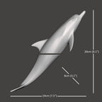 Harmony Dolphin Set by Waterines — 3D sculpted magnetic resin dolphin sculptures swim across a glass coffee table.