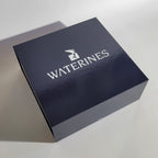 Harmony Dolphin Set by Waterines — 3D sculpted magnetic resin dolphin sculptures swim across a glass coffee table.