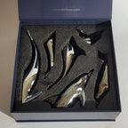 Harmony Dolphin Set by Waterines — 3D sculpted magnetic resin dolphin sculptures swim across a glass coffee table.