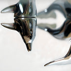 Harmony Dolphin Set by Waterines — 3D sculpted magnetic resin dolphin sculptures swim across a glass coffee table.