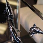Harmony Dolphin Set by Waterines — 3D sculpted magnetic resin dolphin sculptures swim across a glass coffee table.