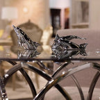 Harmony Dolphin Set by Waterines — 3D sculpted magnetic resin dolphin sculptures swim across a glass coffee table.
