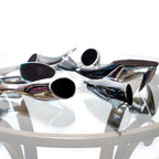 Harmony Dolphin Set by Waterines — 3D sculpted magnetic resin dolphin sculptures swim across a glass coffee table.