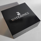 Euphoria Whale Set by Waterines — 3D sculpted magnetic resin whale sculptures breach through a glass coffee table.