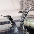 Euphoria Whale Set by Waterines — 3D sculpted magnetic resin whale sculptures breach through a glass coffee table.