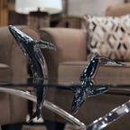 Euphoria Whale Set by Waterines — 3D sculpted magnetic resin whale sculptures breach through a glass coffee table.