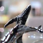 Euphoria Whale Set by Waterines — 3D sculpted magnetic resin whale sculptures breach through a glass coffee table.