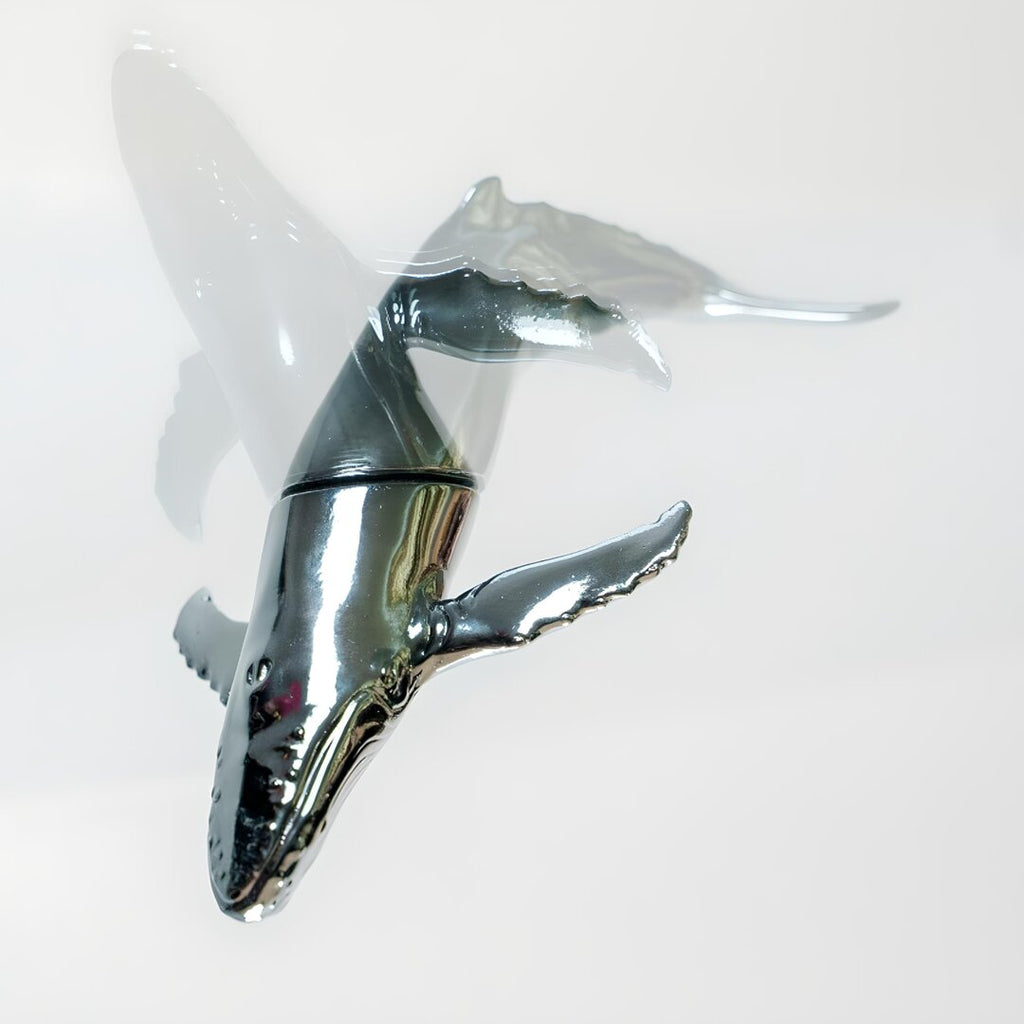 Euphoria Whale Set by Waterines — 3D sculpted magnetic resin whale sculptures breach through a glass coffee table.